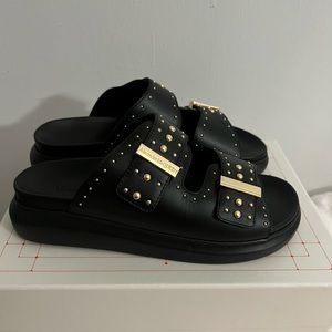 Alexander McQueens Rockstar studded black slides